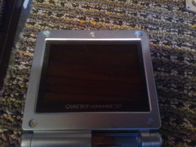 The five screws replaced around the bezel