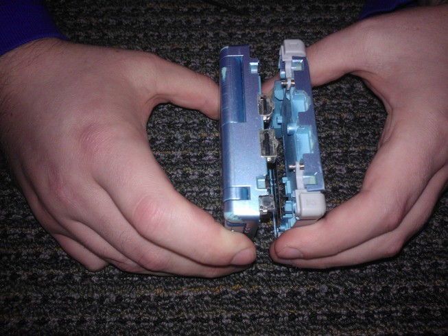 Separating the plastic bottom case from the device
