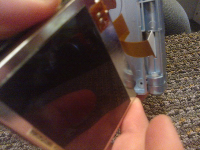 Carefully putting the cable through the slot